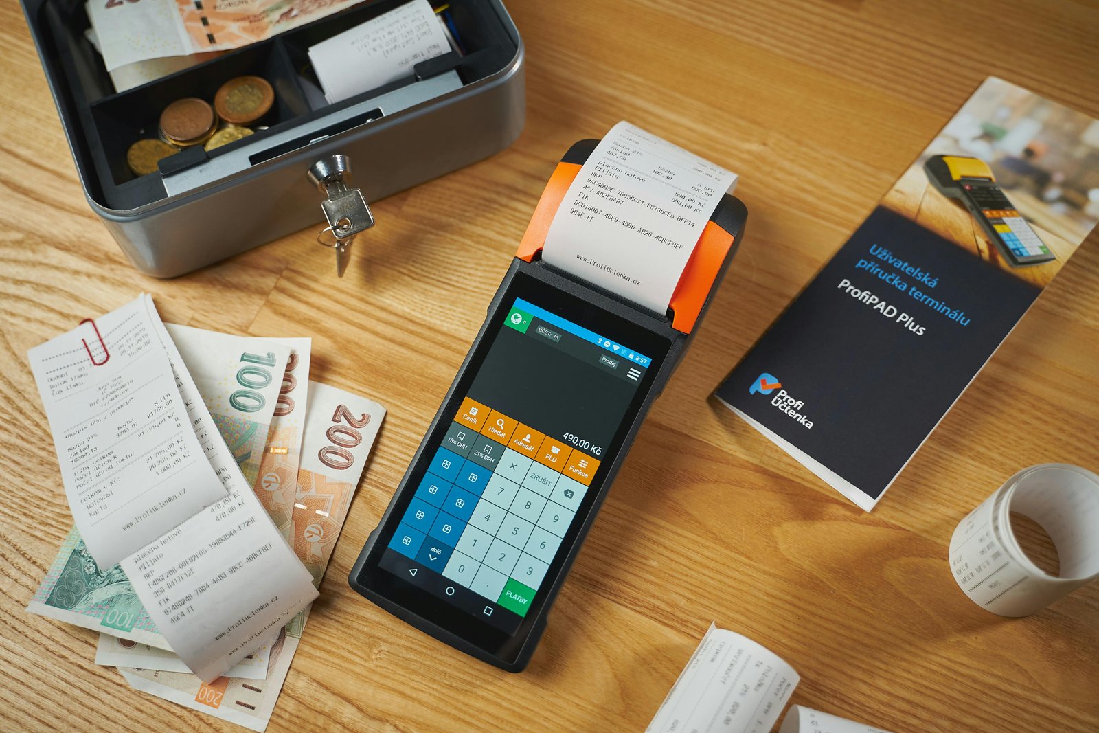 Payment terminal, receipts, and cash used to validate charge records